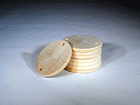 Wooden disc with two drilled holes